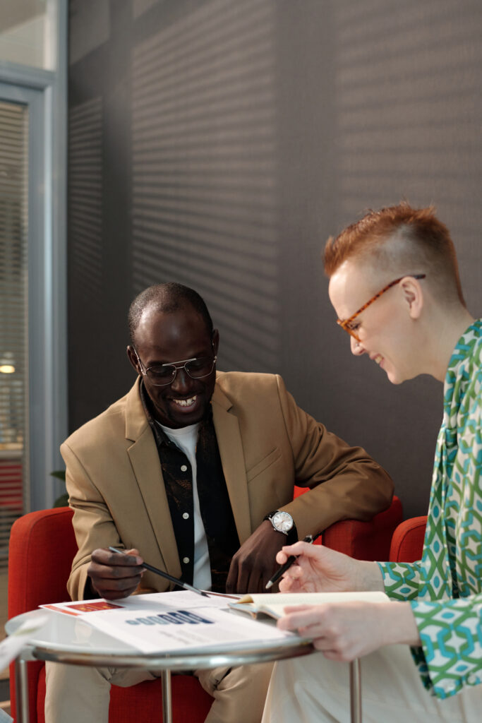 coworkers reviewing documents together in office 2025 03 16 08 24 50 utc